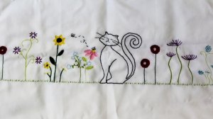 embroidered napkin with cats and flowers