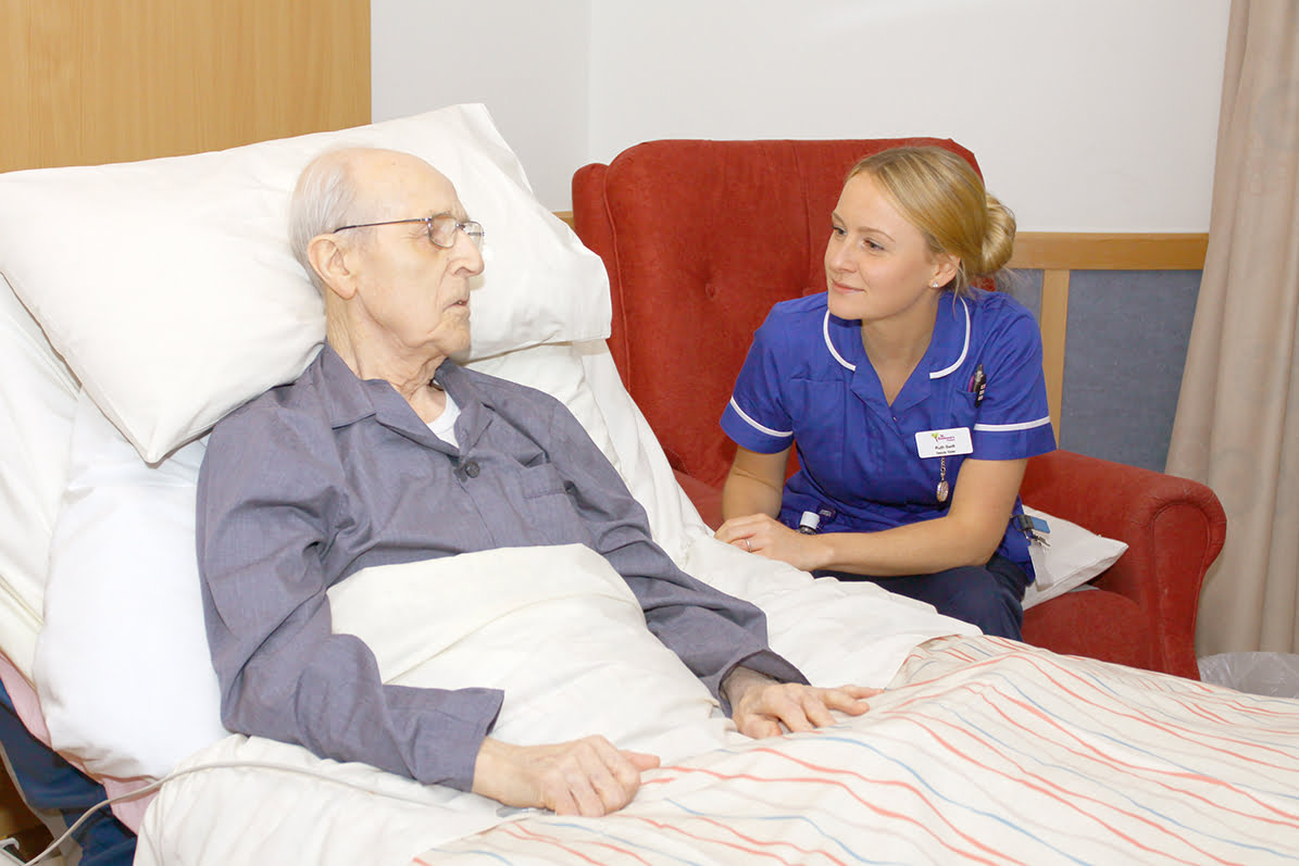 Nurse listening to an elderly patient