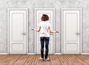 woman choosing which door to go through