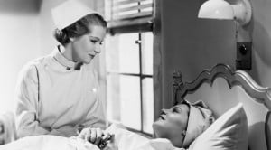 vintage nurse talking to patient