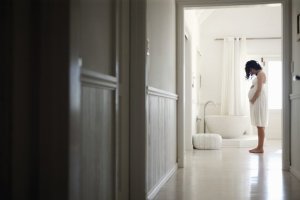 pregnant woman with HG isolated in bathroom
