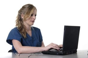 Healthcare worker using laptop