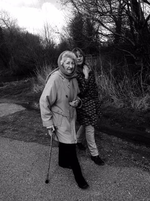 walking with Mum outdoors, with Mum using a stick