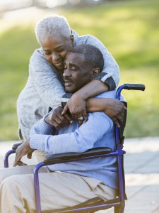 Senior African American couple, man in wheelchair