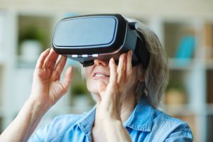 Senior female in virtual reality headset