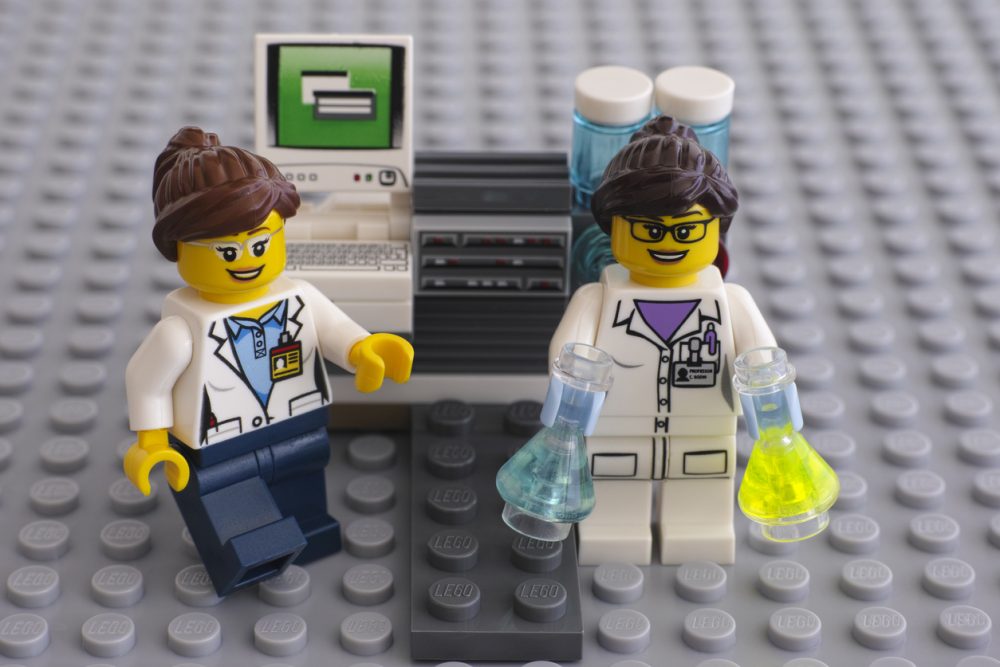 Two LEGO scientists near laboratory computer
